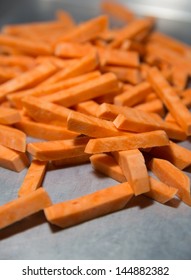 Fresh Raw Hand Cut Sweet Potato Fries on Stainless Steel Pan - Shutterstock ID 144882382
