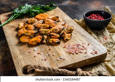 Fresh Raw Mussel Meat On A Wooden Chopping Board. Healthy Seafood.