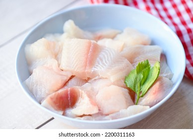 fresh raw pangasius fish fillet with, meat dolly fish tilapia striped catfish, fish fillet on bowl for cooking