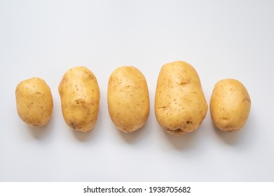 fresh raw potatoes isolated on white background