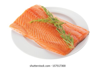 Fresh Raw Red Fish Fillet On White Plate And Rosemary