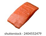 Fresh raw salmon red fish fillet with salt and spices on a dark concrete background