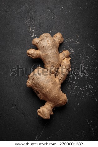 Fresh raw single ginger root black dark background healthy alternative medicine immunity Stock photo © 