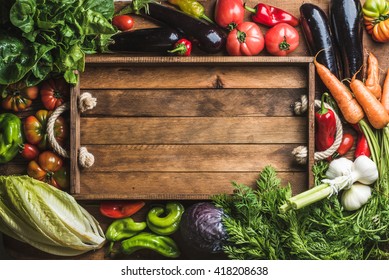 Fresh Raw Vegetable Ingredients For Healthy Cooking Or Salad Making With Rustic Wooden Tray In Center, Top View, Copy Space. Diet Or Vegetarian Food Concept, Horizontal Composition