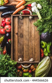 Fresh Raw Vegetable Ingredients For Healthy Cooking Or Salad Making With Rustic Wooden Tray In Center, Top View, Copy Space. Diet Or Vegetarian Food Concept, Vertical Composition