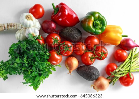 Fresh raw Vegetables on white wooden background