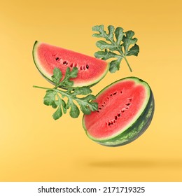 Fresh raw watermelon falling in the air isolated on yellow backgeound. Food levitation or zero gravity conception. igh resolution image. - Powered by Shutterstock