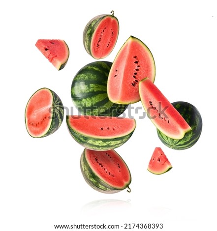 Fresh raw watermelon falling in the air isolated on white background. Food levitation or zero gravity conception. igh resolution image.