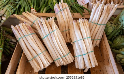 Fresh raw white and green asparagus organic vegetables for sale in local farmers market in Souillac, Dordogne, France - Powered by Shutterstock