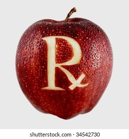 Fresh red apple with "RX" prescription carved in side