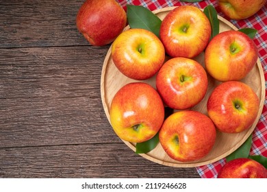 Fresh Red Apple In Wooden Plate On Wooden Background, US. Red Envy Apple On Wooden Table.