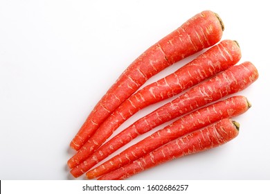 Fresh Red Carrot Bunch On White Background 