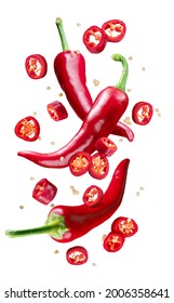 Fresh red chilli peppers and cross sections of chilli pepper with seeds floating in the air. File contains clipping paths. - Shutterstock ID 2006358641