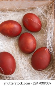 Fresh red eggs and some straw in a wooden crate on a white background. Chicken eggs. Easter concept .Top view - Shutterstock ID 2247009389