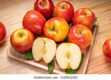 Fresh Red Envy Apple In Wooden Plate On Wooden Background