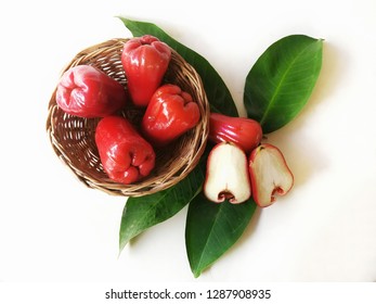 Fresh red rose aaple sweet delicious fruit in basket and  green leaves isolated on white background and famous thailand fruit eating health