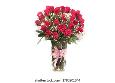 Fresh red rose bouquet in a clear vase in white background - Powered by Shutterstock