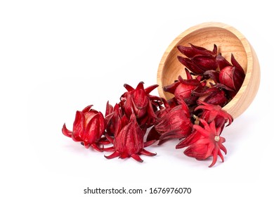 Fresh red Roselle fruit (Jamaica sorrel, Rozelle or hibiscus sabdariffa) in wooden bowl isolated on white background.