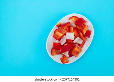 Fresh Red Sweet Pepper With Onion On White Dish