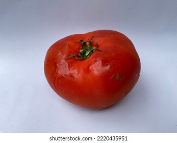 Fresh Red Tomatoes Isolated On White Background. The Tomato Is Consumed In Diverse Ways, Raw Or Cooked, In Many Dishes, Sauces, Salads, And Drinks. Selective Focus