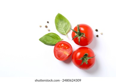 Fresh red tomatoes, pepper and basil on white background, top view