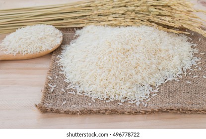 Fresh rice on wood table background / Image Selective focus,copy space - Shutterstock ID 496778722