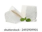 Fresh ricotta (cream cheese) and basil isolated on white