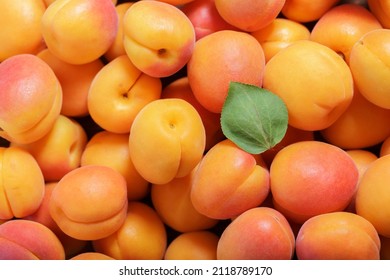 fresh ripe apricots as background, top view - Shutterstock ID 2118789170