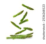 Fresh ripe asparagus falling on white background