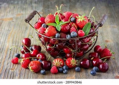 Fresh ripe berries mix, cherries, raspberries, blueberries in vintage basket, summer harvest concept, vitamins, healthy food, vegan ingredients - Powered by Shutterstock