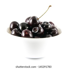 Fresh Ripe Black Cherries In A White Bowl. Isolated On A White Background