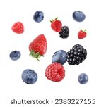 Fresh ripe blueberries, strawberries, raspberries and blackberries falling on white background