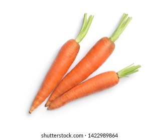 Fresh ripe carrots on white background, top view