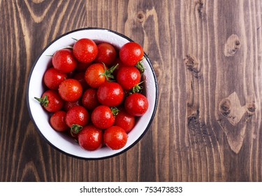 Fresh Ripe Cherrt Tomatoes In Enamel Bowl, Overhead Shot