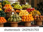 Fresh and ripe exotic fruits on traditional farmer market Mercado dos Lavradores, Funchal, Madeira island, Portugal