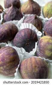 Fresh Ripe Figs  Speckled With Light  Dots , Served In White Paper.  Incredibly Luscious Fruit With A Delicate Aroma And Sweet Flavour.