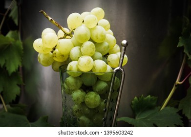 Fresh And Ripe Green Grapes In A Glass With A Tuning Fork;