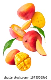 Fresh ripe mango with leaves falling in the air isolated on white background. Food levitation concept. High resolution image - Shutterstock ID 1873536568