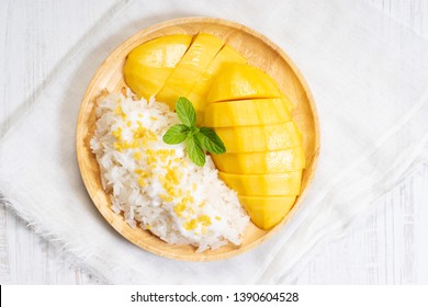 fresh ripe mango and sticky rice with coconut milk, authentic Thai dessert - Shutterstock ID 1390604528