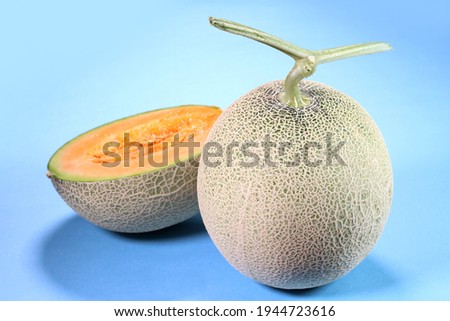 Fresh ripe melon on blue background 