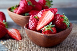Fresh Ripe Organic Strawberries In Wooden Bowl On Table