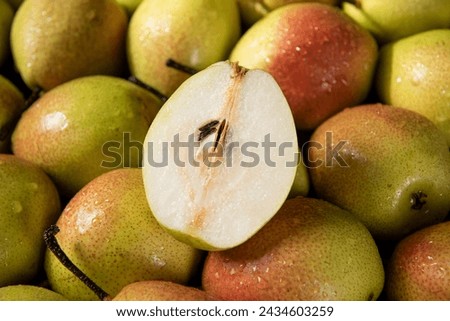 fresh ripe pears with half as background