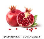Fresh ripe pomegranate with green leaves isolated on white background. High resolution image