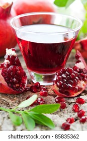 Fresh Ripe Pomegranate And Juice In The Glass