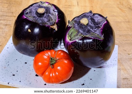 Fresh ripe purple globe Violetta eggplants vegetables from Florence ready to cook, healthy Italian food