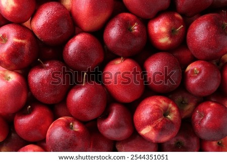 Fresh ripe red apples as background, top view