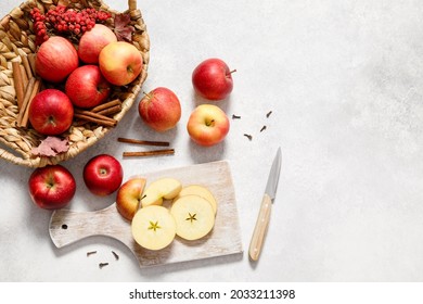 Fresh ripe red apples with knife and chopping board on white table background. Autumn apple flat lay, top view, copy space. Autumn harvest and cooking apple meal, apple pie concept - Powered by Shutterstock