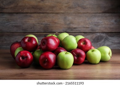 Fresh Ripe Red And Green Apples On Wooden Table