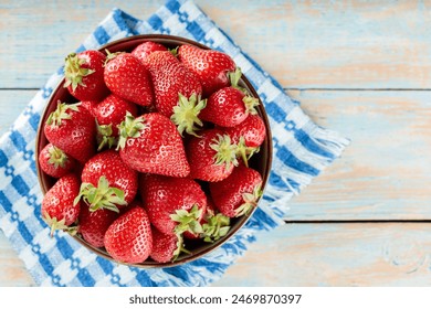 Fresh Ripe Red Strawberries in Bowl on Blue Checkered Cloth over Wooden Surface, Copy Space - Powered by Shutterstock