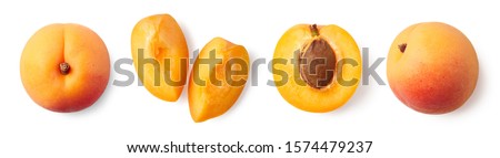 Fresh ripe whole, half and sliced apricot isolated on white background, top view